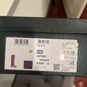 Never worn gray tweed Chanel boots in a size 37.